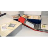 Three shoeboxes containing a large quantity of Royal Mail GB stamps postcards c/w an album of GB