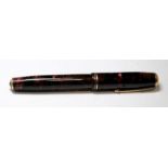 Parker Vacumatic fountain pen with red/black marble finish. Date mark for 1937. 1st generation