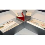 Four shoeboxes containing a large quantity of Guernsey First Day Covers