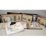 Eight albums of Royal Mail GB stamps postcards