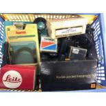 A large crate of vintage photographic accessories and attachments. Some leading brands. Good lot