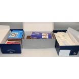 Three shoeboxes containing a large quantity of Guernsey presentation packs and stamps sheets