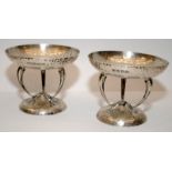 Pair of Arts and Crafts silver Bon Bon dishes. Each raised on tri sinuous curvilinear supports to