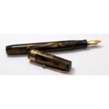 Swan Visofil Mk1 fountain pen V211/64. Brown amber marbled body with wide gold plated filigree cap