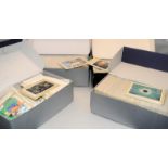 Four shoeboxes containing a large quantity of Royal Mail GB stamps postcards.