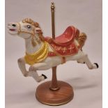 An attractive large ceramic carousel horse ornament on wooden pole and base 37cm tall.