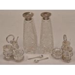 Pair of vintage silver topped crystal glass bottles together with two vintage silver plated