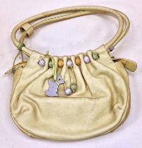 Radley ladies beige leather handbag with tags still attached.