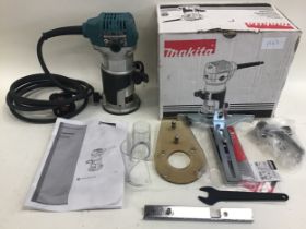 Makita RT0700CX4 trimmer boxed.