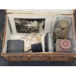 A large vintage steamer trunk with contents to include four WW2 service medals, a Royal Navy