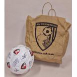 Local sporting interest: AFCB Bournemouth signed football with paper bag.