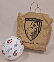 Local sporting interest: AFCB Bournemouth signed football with paper bag.