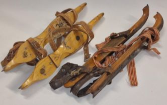 Two pairs of vintage ice skates.