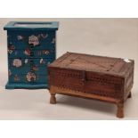 A vintage wooden carved box together with a miniature jewellery cabinet (2).