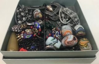 A box containing antique shoe buckles, trade beads and miscellaneous items.