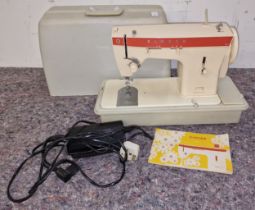 Singer vintage model 367 sewing machine in case with instructions.