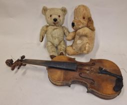 Two vintage teddy bears together with an antique violin.