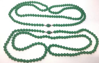 Two antique long Deco Jadeite/Glass? necklaces.