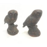 A pair of owl figures.