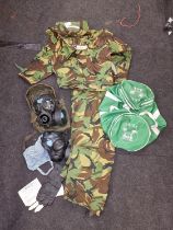 A gulf war era complete Hazmat suit in green carry bag.