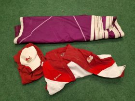 Collection of London Commonwealth Games 2014 clothing together with a London 2012 Olympics banner.