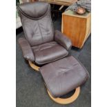 Contemporary designer leather recliner armchair with matching footstool.