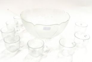 A glass punch bowl set.