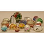 A collection of decorative glass paperweights (18).