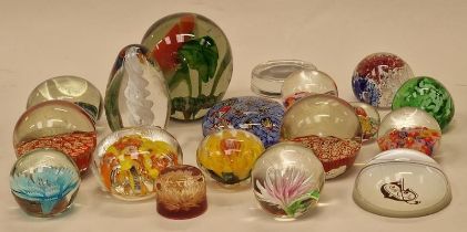 A collection of decorative glass paperweights (18).