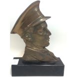 A WW1 style brass soldier mounted on a marble plinth 25cm tall.
