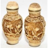 Two Oriental carved scent bottles. 7cm tall