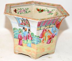 Oriental Famille Rose planter of hexagonal form with garden scenes. 18cms tall