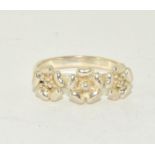 A 925 silver triple flower ring Size R.