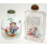Two Oriental decorated glass scent bottles, the largest being 8.5cms tall