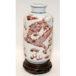 Chinese iron red & underglaze blue dragons vase and stand, Guangxi six character mark to bas. 19th
