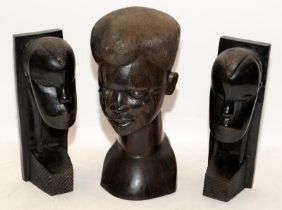 Three hand carved hardwood busts of African figures. One male, two female. Tallest is 27cms