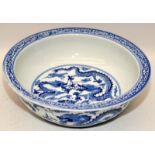 Large Chinese blue and white porcelain basin decorated with twin five claw dragons chasing pearl