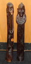 Large floor standing wooden carved figures of an African male and female. Possible fertility