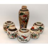 Five Chinese crackled glaze jars, two covers and a tall vase.