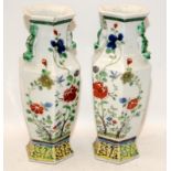 A pair of Chinese Famille verte hexagonal vases, painted with an array of insects and butterflies