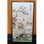 A Large Chinese needlework embroidery of birds, calligraphy & seal to top corner, framed & glazed