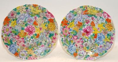 Pair of famille rose Millefleur dishes, marked, circa 1910. D 20.5cm