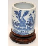 A Chinese 19th century blue & white scholars brush pot, Bitong. Painted with figures drinking tea in