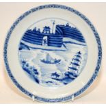 Chinese porcelain blue & white shallow bowl painted with a fortress & landscape river scene,