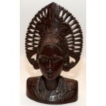 Indonesian wood carved head and shoulders figure of a woman wearing headdress. 30cms tall