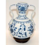 Chinese blue & white twin handled garlic mouth vase painted flowers on wooden plinth, six
