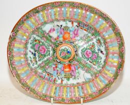 Vintage Oriental Famille Rose oval plate with pierced border around painted scenes. 27cms across