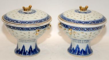 A pair of Chinese 19th century Kangxi style rice grain tureens with inner bowls and finished with