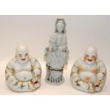 A pair of Chinese porcelain blanc de chine Buddhas with gilt decoration (H14cm) and a figure of