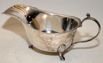 Silver H/M three leg sauce boat set on triple hooved feet and scalloped edge 170g